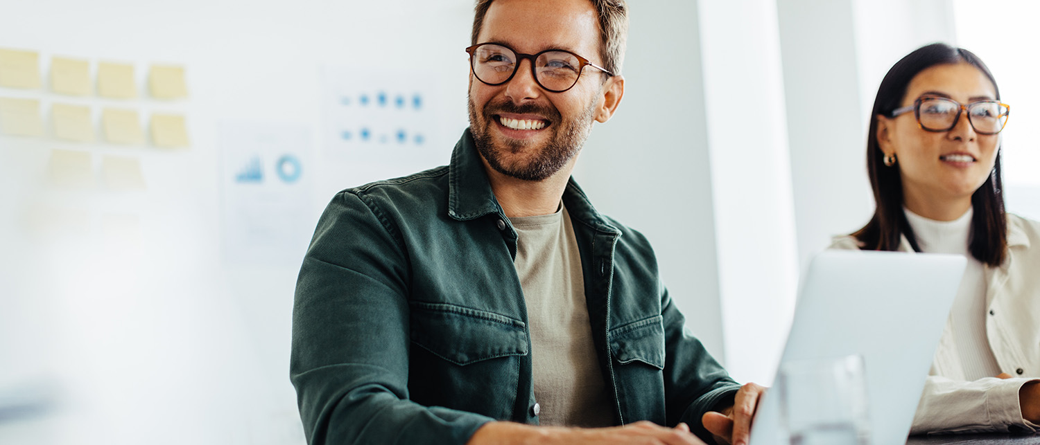 two people sitting in a meeting room