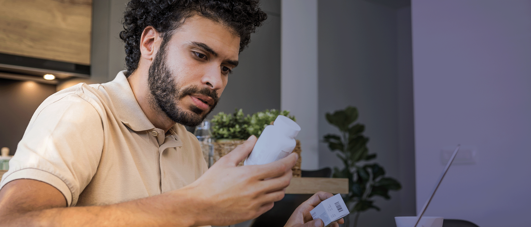 Man holds a prescription medication container